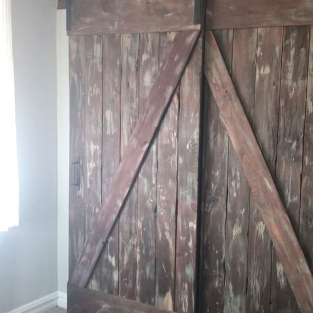 Hard to believe we made these #rustic #barndoors last June/July. A lot of planning and prep work went into it, but the end result was worth it all 👍🏻 We stained the wood with Red Oak after we distressed and gave the wood a worn, old/rustic look. Also, great fir a DIY project on a budget 👌🏻 #wood #woodworking #woodwork #woodporn #woodgrain #woodcraft #dowoodworking #reclaimedwood #furnituredesign #rustic #rusticdecor 
#rusticfurniture #interiordecorating #interiordecor #interiorstyling #homedecor #homestyling #farmhousechic #barnwood #farmhouse #farmhousestyle - keith (@bluelotuswoodworks)